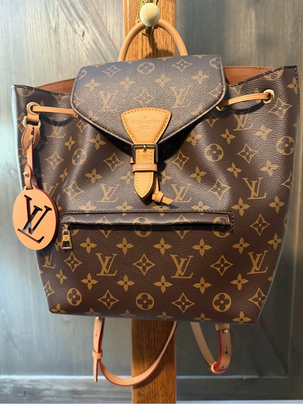 Louis Vuitton Monogram Canvas Backpack with Tan Leather Trim and Pink Charm